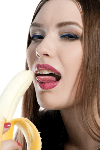 a woman practicing oral sex on a banana