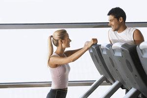 a man and woman flirting at the gym