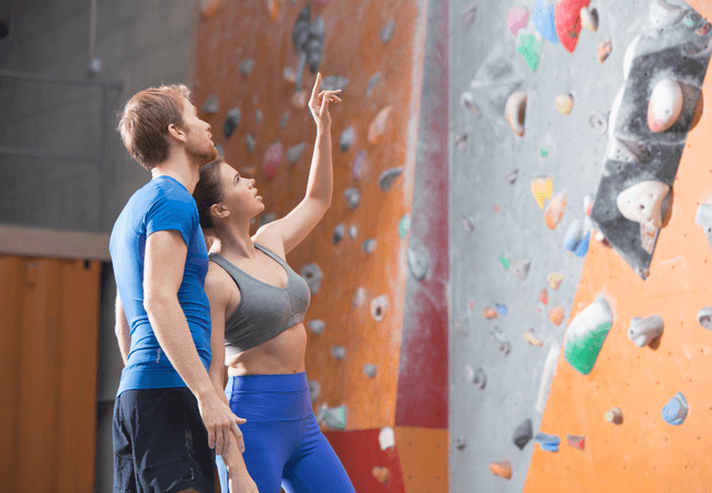 a couple rock climbing together